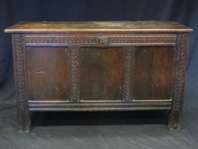 A 19th century oak coffer, the rectangular top with a moulded edge above a triple panelled front,