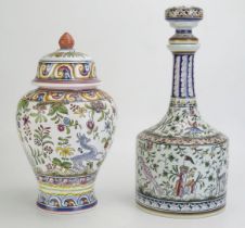 A Portuguese porcelain decanter and stopper, decorated with dogs, birds a flowering shrubs, 35cm