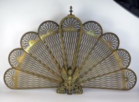 A reproduction French style folding fan fire screen, raised on winged dragon and swept support, 60cm