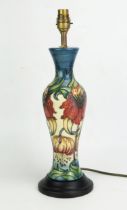 A Moorcroft pottery table lamp, of baluster form with Anna Lilly pattern decoration, mounted on a