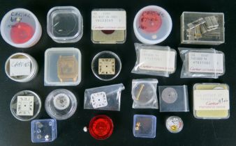 A Selection of Cartier Watch Parts including dials, crowns, gold plated watch case (no. 96053086),