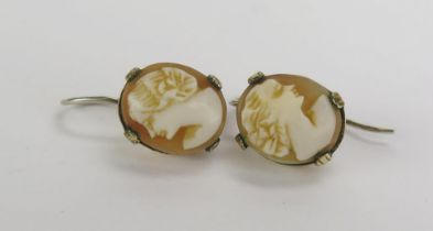 A Pair of Yellow Metal Mounted Shell Cameo Earrings decorated with a female bust in profile, 12.