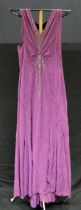 A 1920's/30's ladies cocktail dress in purple with fringed V-neck line with applied paste set