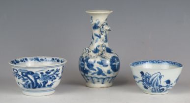 Two Chinese blue and white decorated tea bowls of traditional design together with a small blue