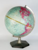 A Phillips 11ins terrestrial globe, raised on a hexagonal base.