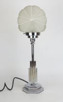 An Art Deco style chrome table lamp, with shell-shaped frosted glass shade raised on a polygonal