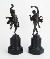 A pair of 19th century Grand Tour bronze figures after the antique of dancing Bacchanalian satyrs,