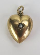 A 9ct Gold and untested Pearl Heart Shaped Pendant, stamped 9CT, 25mm drop, 2.24g