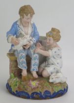 A Paul Duboy porcelain spill vase decorated with a seated boy and kneeling girl playing with