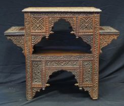A Liberty style Moorish carved hardwood occasional table, the rectangular top with carved central