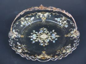 A Victorian papier mache swing handled sandwich plate, with inlaid mother-of-pearl floral