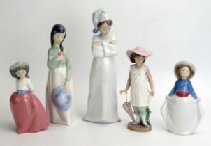 Lladro and Nao, five assorted porcelain figurines of young girls and boy in a night shirt. (5)