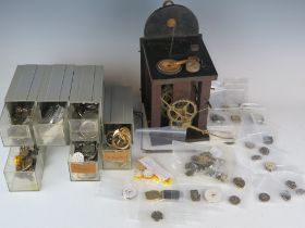 A Selection of Watch Parts including eight new balance wheels and a 19th century clock