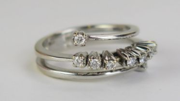 A Modern 18ct White Gold and Diamond 'Slide' Ring with a triple split shank, stamped 750, with