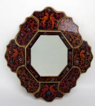 A Peruvian reverse painted wall mirror, with octagonal mirror plate enclosed by panels of birds