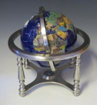 A 20th century table top terrestrial 8ins globe the continents outlines inlaid with mother-of-