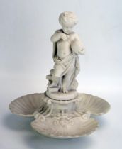 A Minton Parian table centrepiece, surmounted by a putti holding a globe, and with three shell-