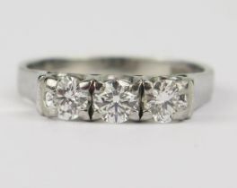 An 18ct White Gold and Diamond Three Stone Ring, set with three c. 4.1mm brilliant round cut stones,