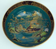 A Carlton ware fruit dish, decorated in the Chinoiserie taste with pagoda landscape, to a green