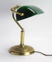 A lacquered brass banker's table lamp with green glass shade, on spiral twist column and weighted