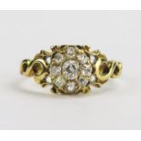 A Georgian Old Cut Diamond Cluster Ring in a pierced precious yellow metal setting, c. 3.25mm