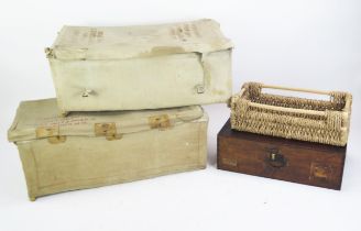 Two wicker and canvas bound military laundry baskets, wicker tray and a mahogany box.