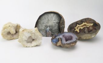 A small collection of polished quartz geode sections.