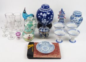 A collection of Chinese ceramics including ginger jars and covers, temple vase, cockerel, and