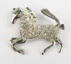 A 9ct White Gold and Diamond Horse Pendant, 26mm long, hallmarked, maker A & A, 3.53g