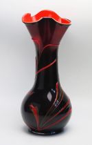 A Murano style art glass vase, of waisted form with flared lobed rim, with whiplash decoration, 44cm