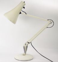 Herbert Terry, a 1970's model 90 angle-poise table lamp, in pale cream on a weighted circular base.