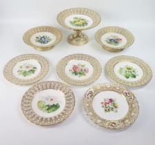 A late 19th century porcelain part fruit service decorated with painted botanical specimens,