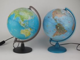 A 10ins terrestrial illuminated globe on a circular plastic base, together with another 10ins