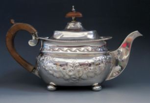A Victorian silver teapot, maker's mark worn, Birmingham, 1892, of barge-shaped outline, with