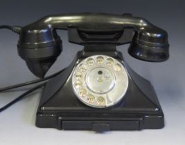 A GPO Model 1/232F telephone hand set in black Bakelite, with drawer to the base