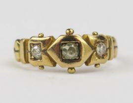 A Victorian 18ct Gold and Diamond Three Stone Ring, set with old mine cut stones with the largest c.