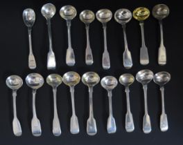 A collection of seventeen Old English pattern mustard spoons, various makers and dates, most