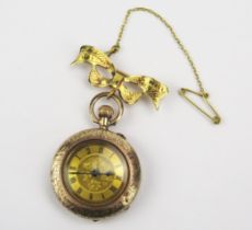 A 9ct Gold Ladies Fob Watch (28.7mm case) and on a hallmarked 9ct gold ribbon suspension brooch