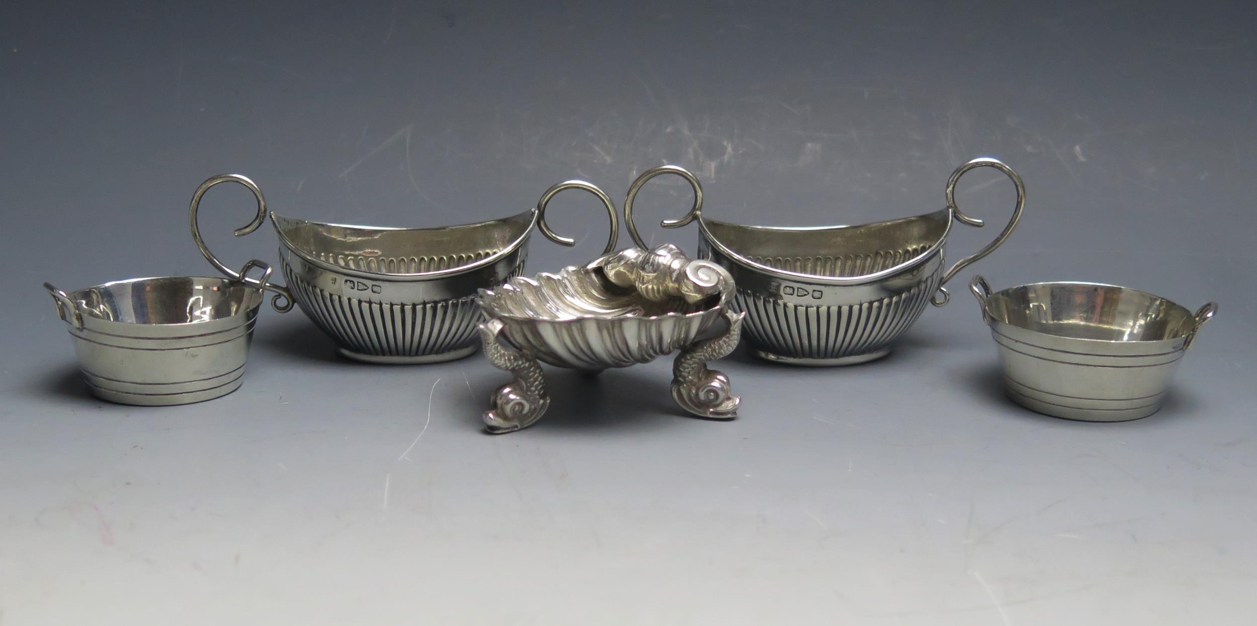 A pair of Victorian silver salts, maker's mark worn, Chester, 1894, together with another pair of