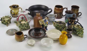 A mixed collection of assorted pottery wares, various makers, includes mugs dishes, tea set, bowls