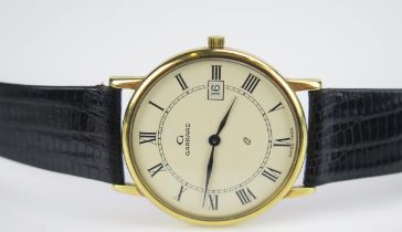 A GARRARD 18ct Gold Quartz Wristwatch, 33mm case back no. 2399. In Garrard box, needs new battery,
