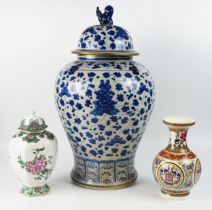 A large modern Chinese blue and white vase and cover, of ovoid outline, the domed cover surmounted