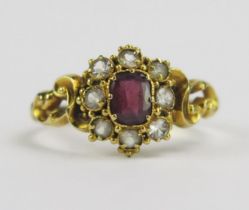 A 19th Century Precious Yellow Metal and Paste Ring with pierced rococo scroll shoulders, size N.25,