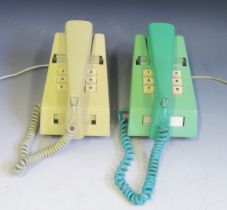 A British Telecom model 1/766 push-button trim phone in yellow ochre, with plug in lead, circa