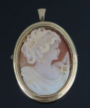 A 9ct Gold and Shell Cameo Brooch decorated with the bust of a lady in profile and with pendant