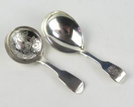 A Victorian silver caddy spoon, maker Chawner & Co, London, 1843 crested and initialled, and another