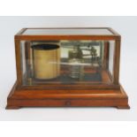 Yeates & Son, Dublin, an oak cased barograph, with seven tier vacuum and single recording arm,