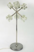 An early IKEA Isasa 'Ice Cube' table lamp, with polished chrome stem and weighted circular base,