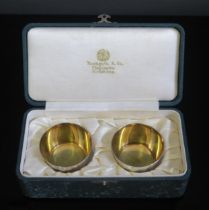 A pair of Japanese sake cups, of plain circular form, with gilded interior, on a circular foot, 4.