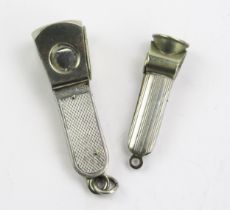 An Elizabeth II silver framed cigar cutter, maker W M Ltd, Birmingham, 1971, with engine turned